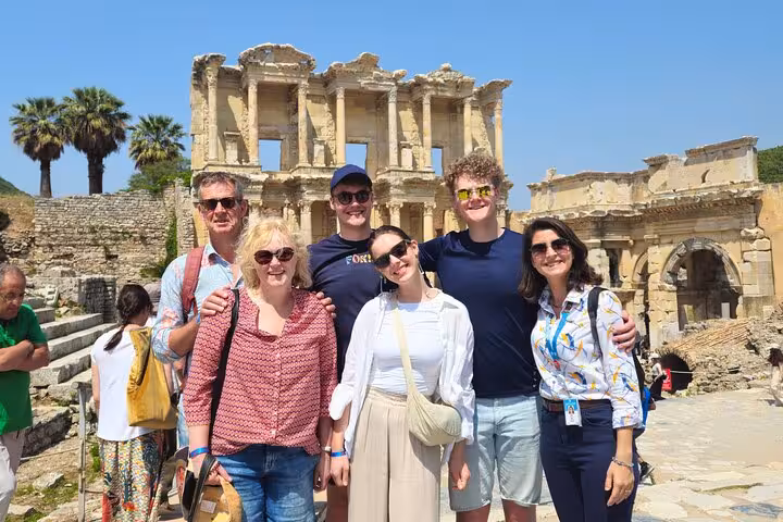 Happy travelers posing at the Library of Celsus on Ephesus tour from Istanbul by plane with guide