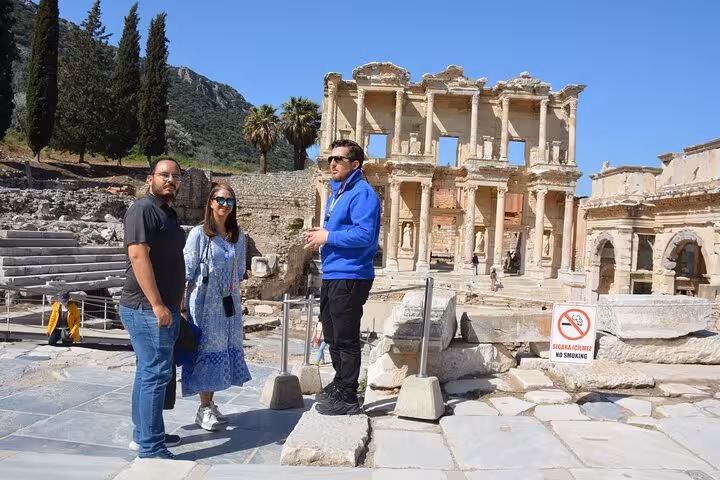Guided Ephesus tour by plane from Istanbul with travelers at Library of Celsus ruins in Selcuk