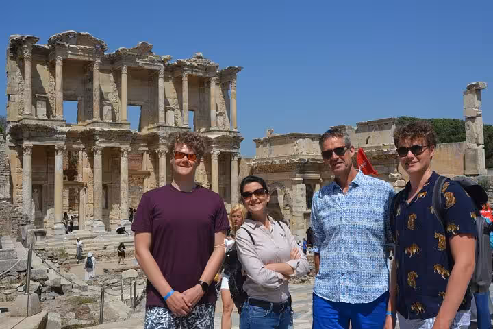 Travelers on Ephesus tour from Kusadasi cruise port posing by the Library of Celsus, skip-the-line entry