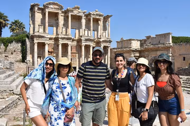 Friends in front of the Library of Celsus during Ephesus tour from Kusadasi, expert guide and ruins