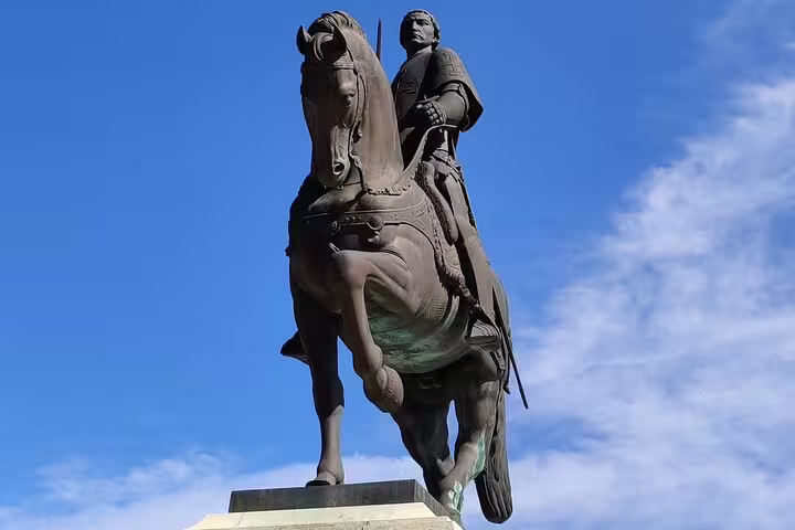 Equestrian statue under a clear blue sky, featured on a private day tour to Fatima, Batalha, Nazaré, and Obidos.
