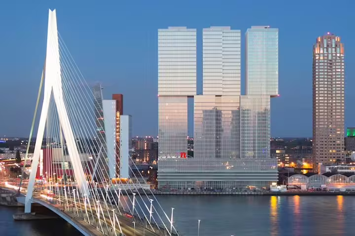 Erasmus Bridge and Rotterdam skyline at dusk, key stop on the self-guided e-scavenger hunt city tour