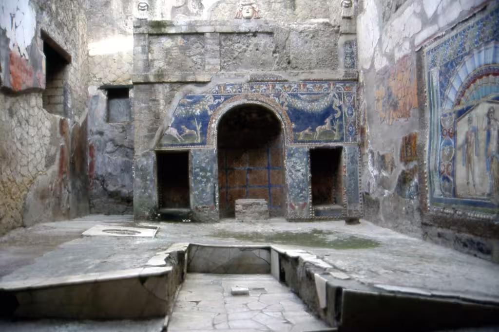 Intricate mosaics and frescoes inside a preserved Roman house in Herculaneum, featured on Ercolano and Mt Vesuvius wine tours