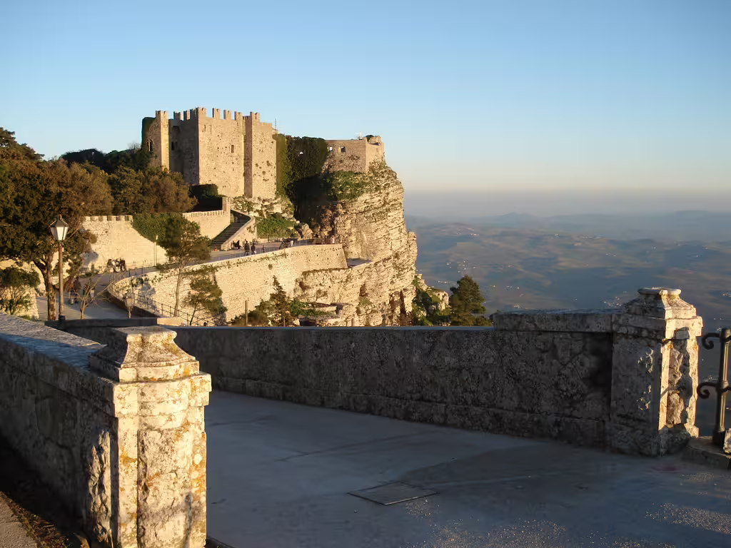 Sunset over Erice Castle and scenic cliffside walkway overlooking Trapani countryside on a private day trip from Palermo