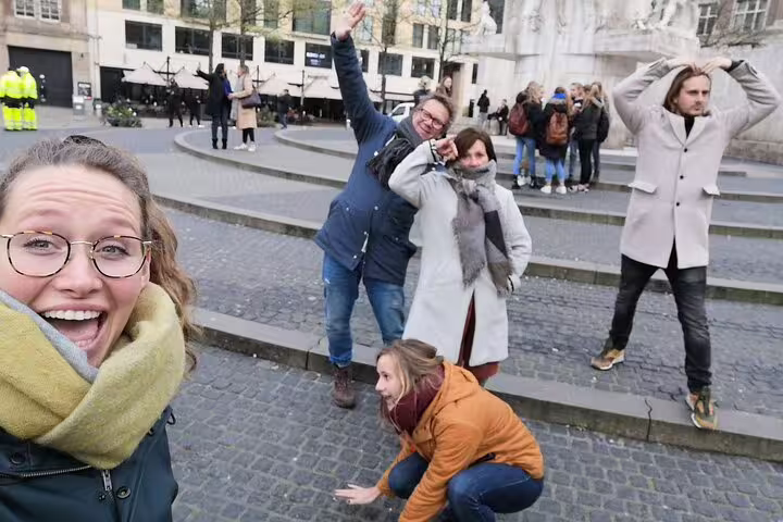 Team posing in a Luxembourg City square during an e-scavenger hunt, interactive self-paced city game