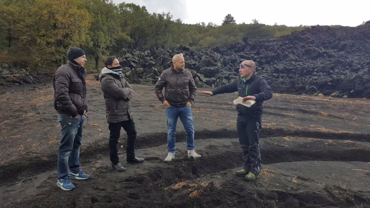 Tour guide briefing guests on Mount Etna lava flows during Taormina 4x4 jeep tour with lunch choice