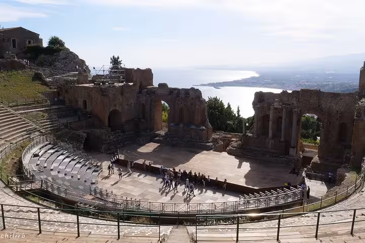 Ancient Greek Theatre of Taormina with panoramic views of the Sicilian coastline, a highlight of the Etna and Taormina tour.