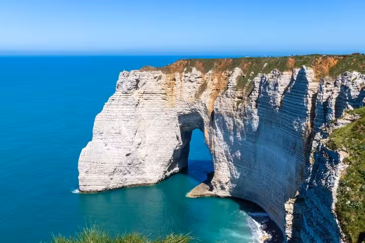 White chalk cliffs with natural arch at Etretat on the Normandy coast, France