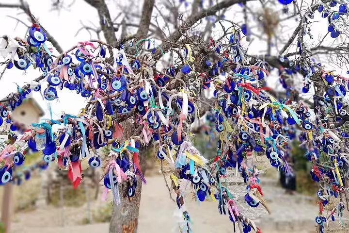 Colorful evil eye charms on a wish tree in Cappadocia, included on 3 day Istanbul to Cappadocia cave hotel tour