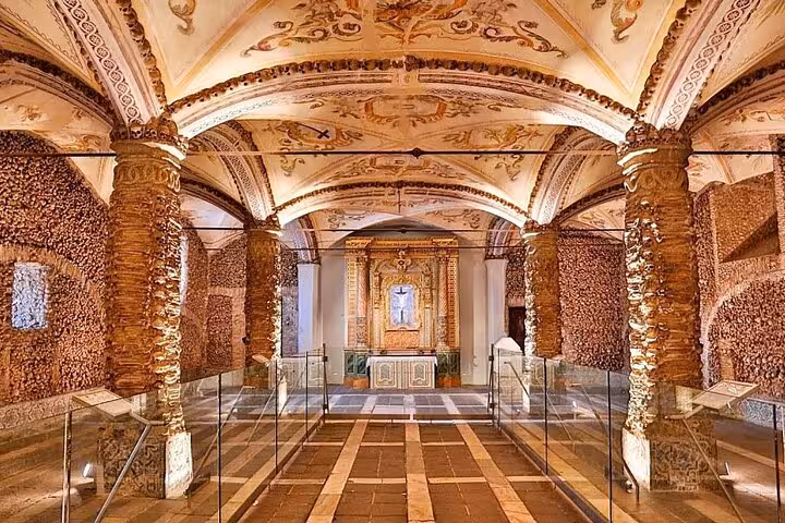 Interior of the Chapel of Bones in Évora, featuring ornate arches and columns, a highlight of cultural tours.