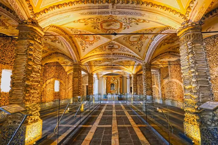 Interior of Évora's Chapel of Bones, showcasing ornate columns and a stunning ceiling, featured in the small group tour.
