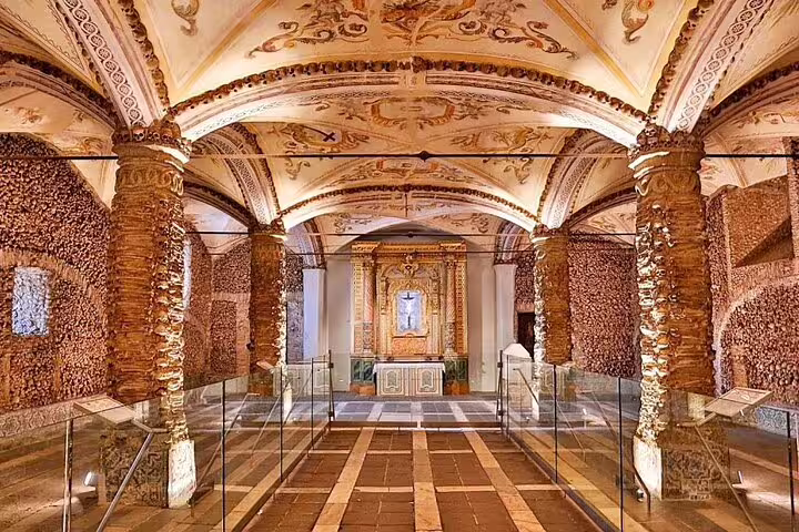 Explore the ornate Chapel of Bones in Évora during a private full-day tour from Lisbon, showcasing historic architecture.