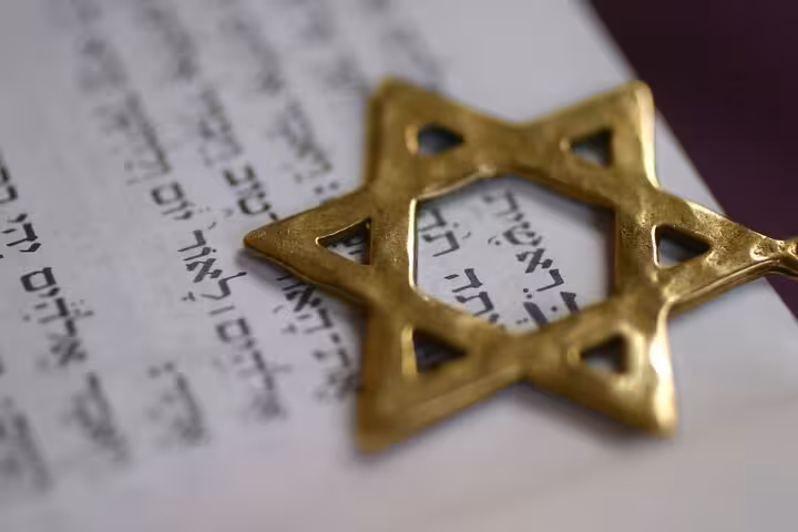 Close-up of a Star of David on a Hebrew text, symbolizing Évora’s rich Jewish heritage on a private walking tour.