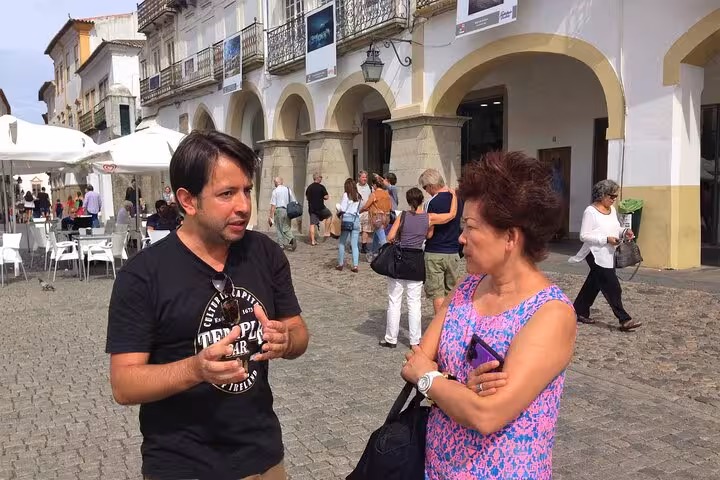 Engage with a knowledgeable local guide during a private walking tour in Évora, exploring historical streets and landmarks.