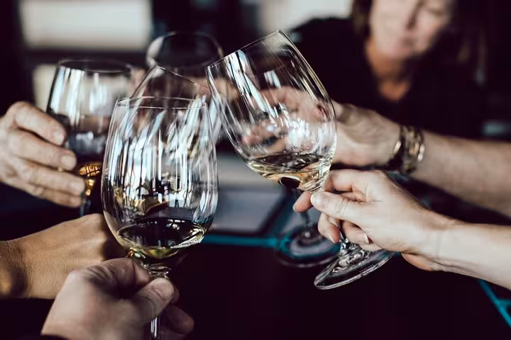 Enjoy a toast with premium wines during the Évora private tour, offering exclusive tastings in a vibrant setting.