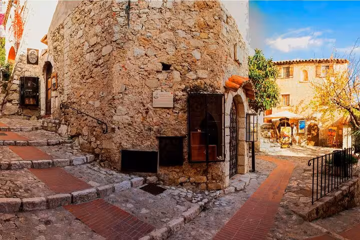 Stone alley in Eze medieval village on French Riviera, scenic stop on private Cannes Nice Monaco tour
