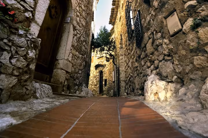 Narrow stone alleyway in Eze medieval village, French Riviera