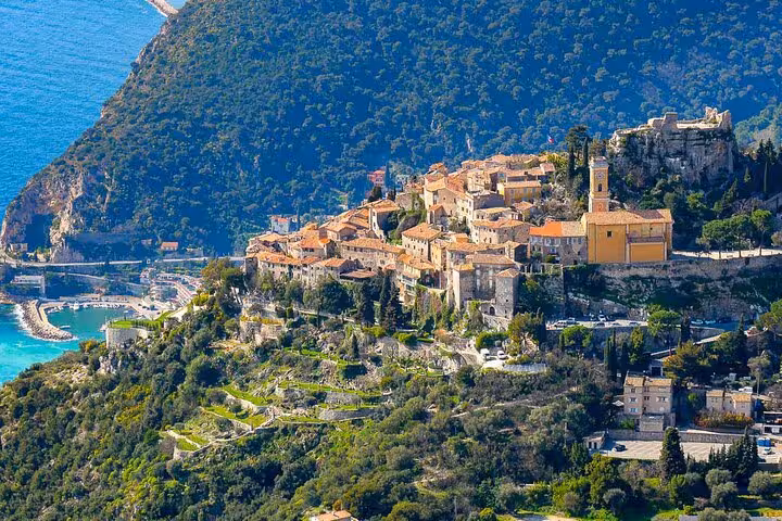 Aerial view of the picturesque Eze Village perched on a hill, overlooking the azure Mediterranean Sea, perfect for a private tour.