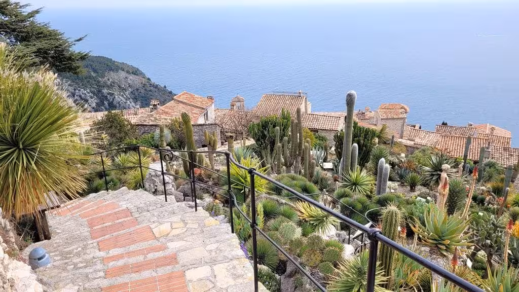 Exotic cactus garden in Eze Village with terracotta rooftops and Mediterranean Sea views
