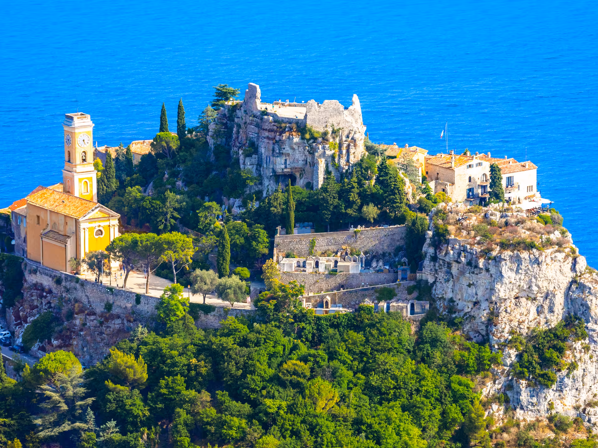 Aerial view of Eze Village perched on a rocky cliff overlooking the Mediterranean Sea, French Riviera