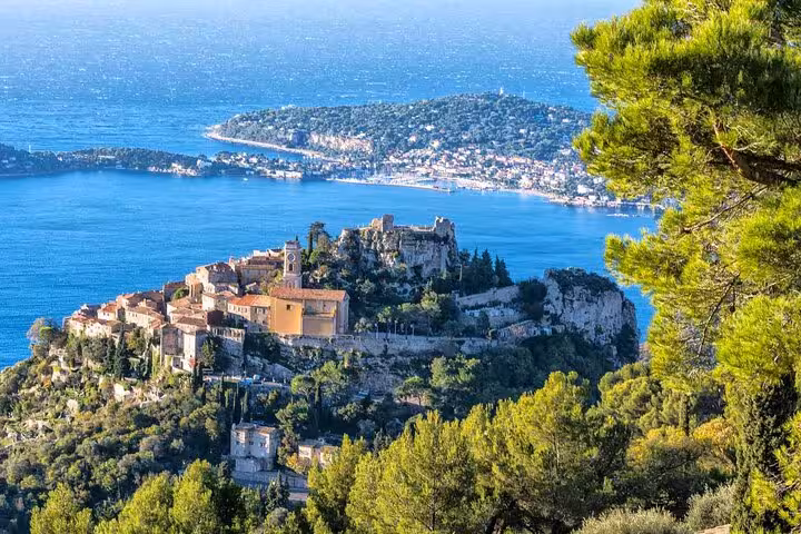 Aerial view of Èze village perched on clifftop overlooking French Riviera coastline and Mediterranean Sea