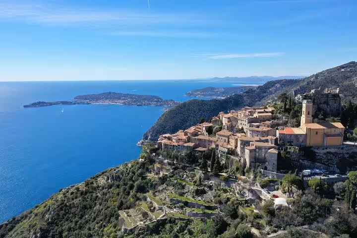 Aerial view of Eze medieval village perched on hillside overlooking the French Riviera and Mediterranean Sea
