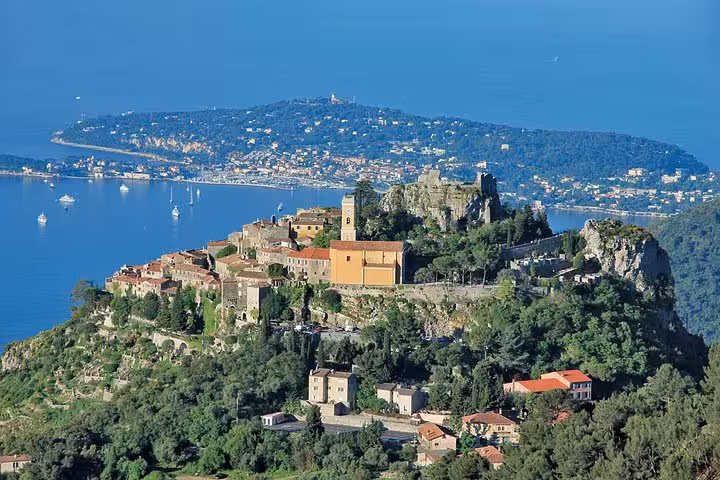 Aerial view of Eze village perched on rocky hilltop overlooking the Mediterranean Sea and Cap Ferrat peninsula