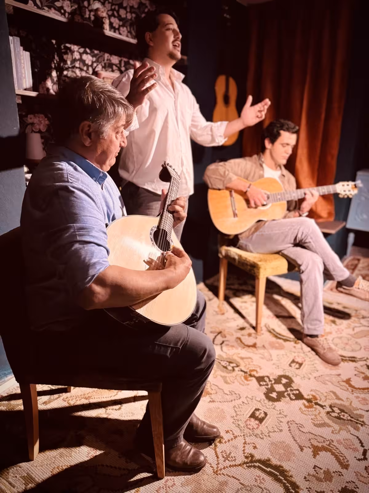 Traditional Fado musicians performing live with acoustic guitars in an authentic Portuguese venue.