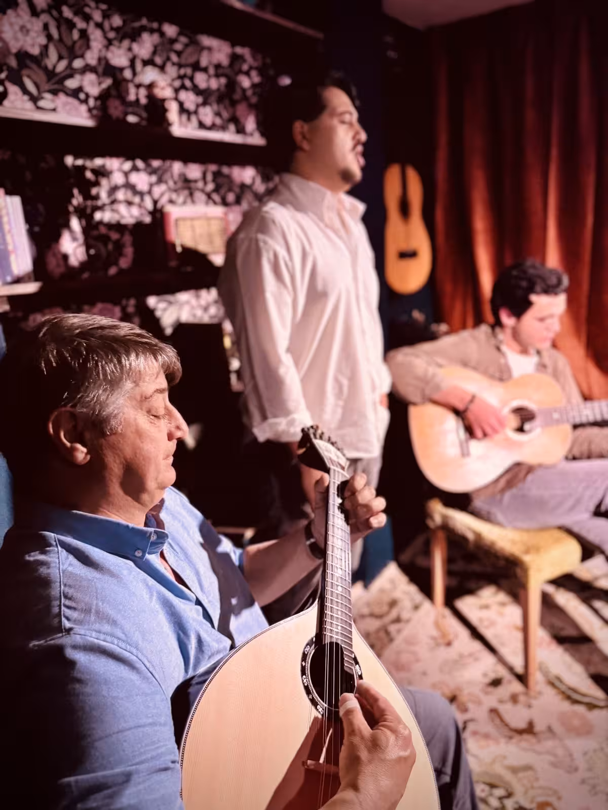 Intimate Fado performance with passionate singer and guitarists in cozy Portuguese setting.