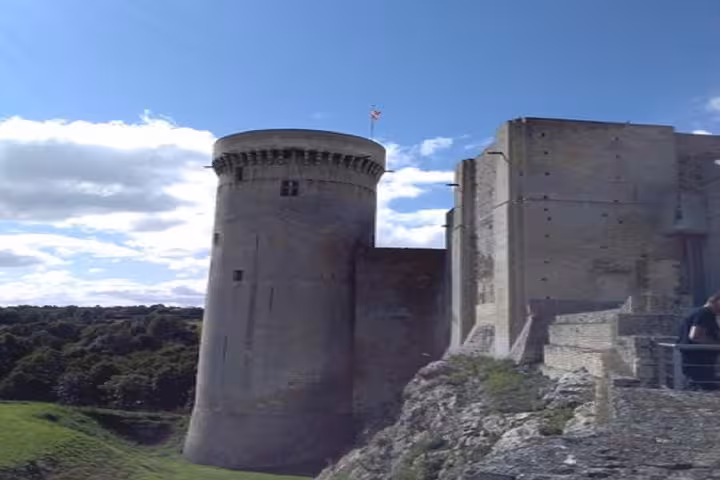 Medieval Falaise Castle tower and keep on rocky hillside, Normandy, France