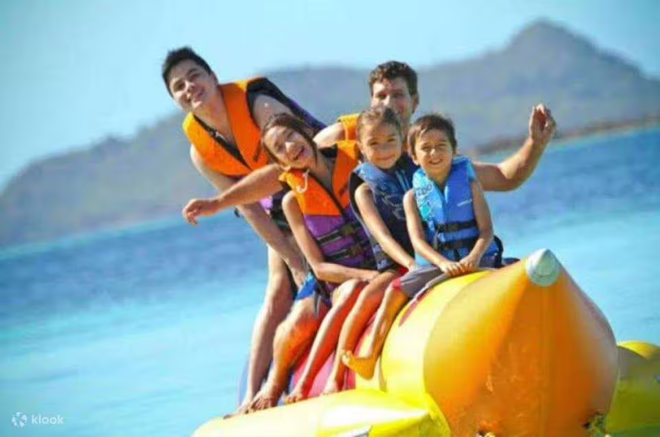 Family enjoying banana boat ride in Sharm El Sheikh on a Red Sea water sports adventure day out