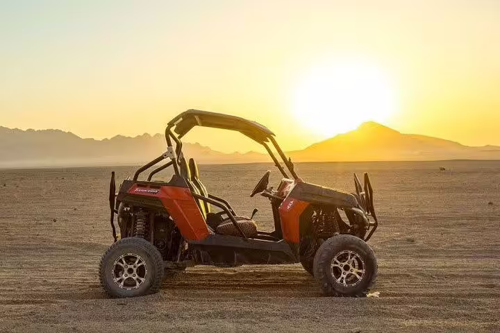 Off-road buggy at sunset on Sinai desert, family buggy adventure desert safari tour from Sharm El Sheikh