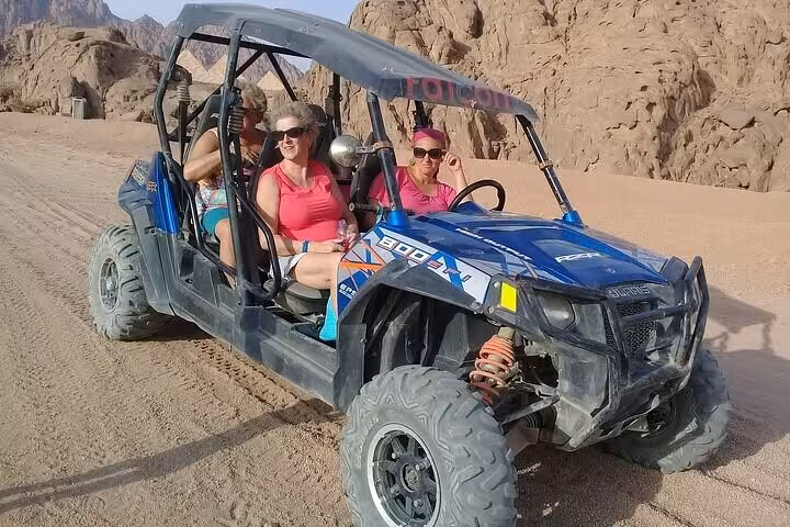 Family buggy safari Sharm El Sheikh, blue off-road car with passengers exploring Sinai desert trails