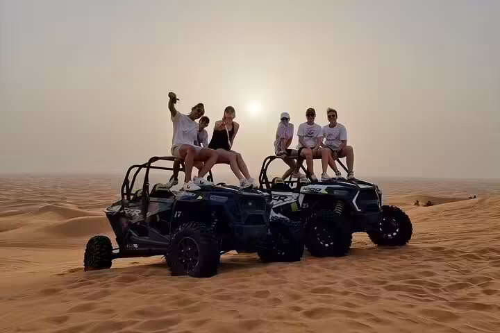 Group on off-road family buggy in Sharm El Sheikh at sunset, Sinai desert dunes safari photo stop