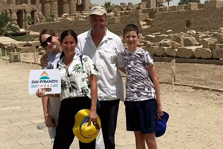 Family at Karnak Temple ruins in Luxor on 3-day private city break package with accommodation and meals