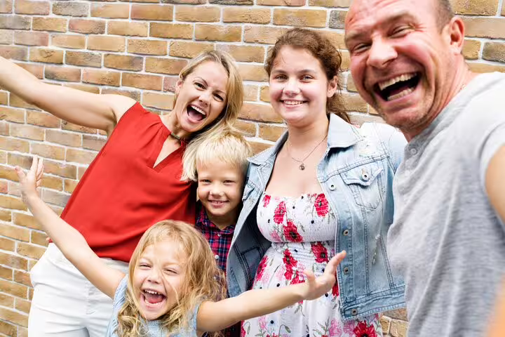 Smiling family group photo for a Milan e-scavenger hunt, a fun self-guided city tour for all ages