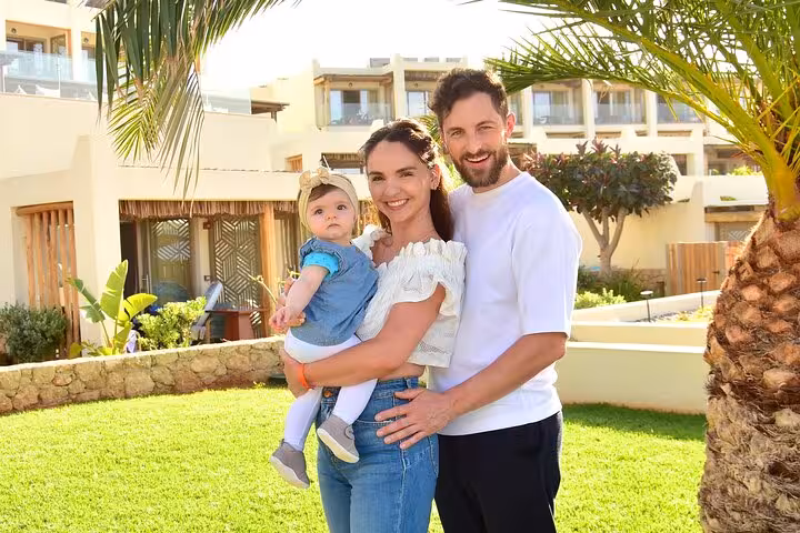 Family enjoying a sunny day in Hersonissos garden, ideal for a private photoshoot experience.