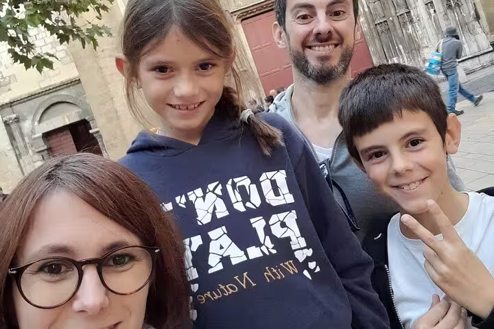 Family selfie on Aix-en-Provence scavenger hunt, exploring Old Town streets on a self-guided tour
