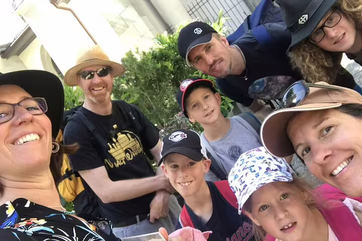Family group selfie smiling together outdoors in Zurich during a walking tour