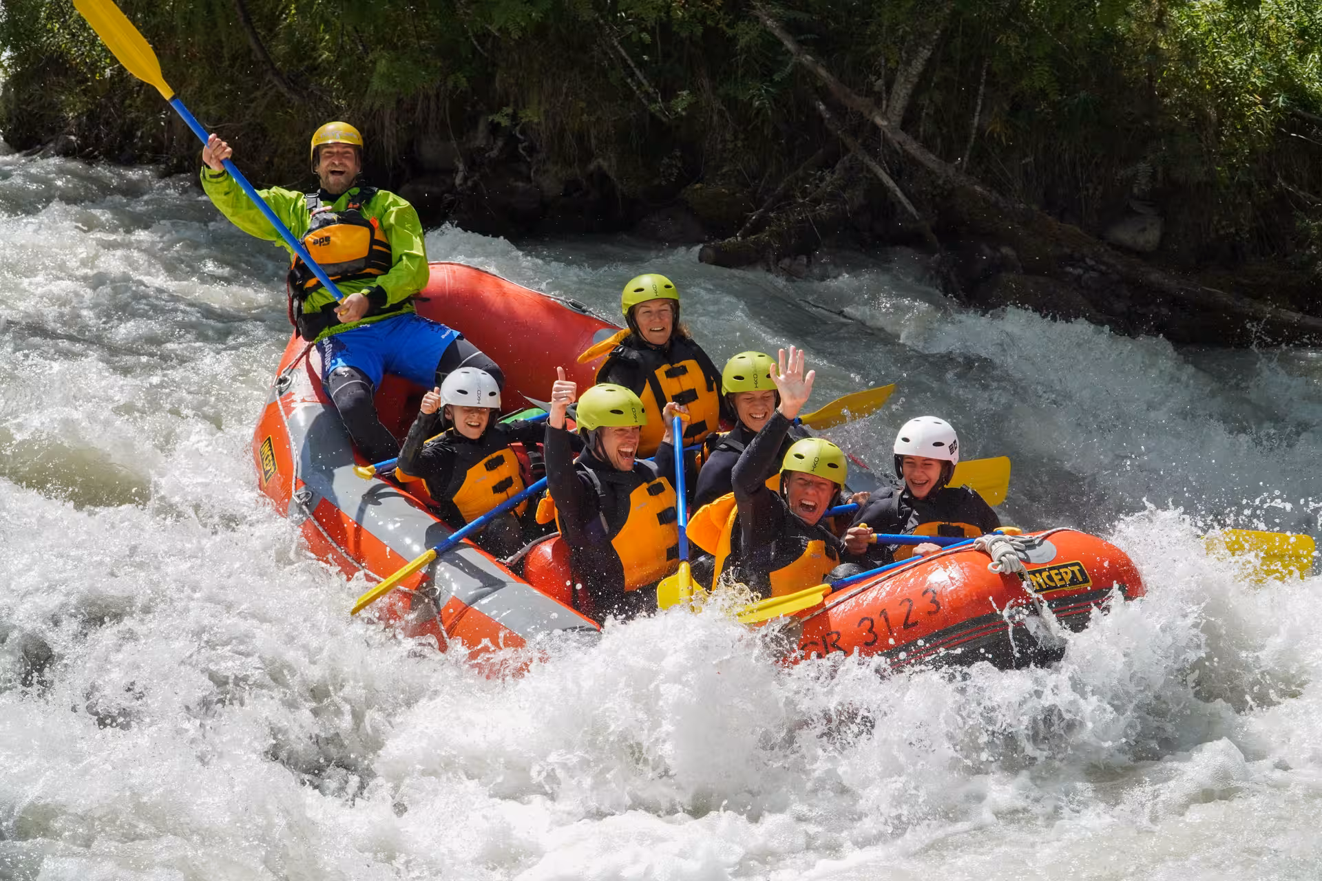 Family enjoying thrilling white-water rafting adventure in Engadin with Fun for All Rafting tour.