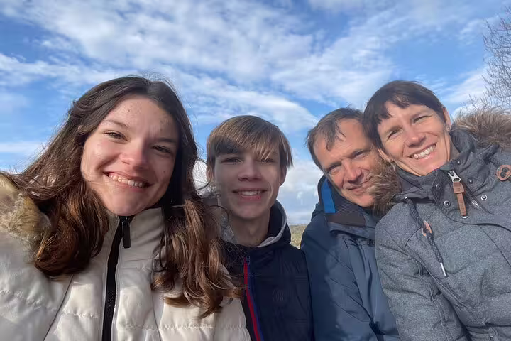 Family selfie in winter jackets on the Winterthur scavenger hunt and sights self-guided tour outdoors