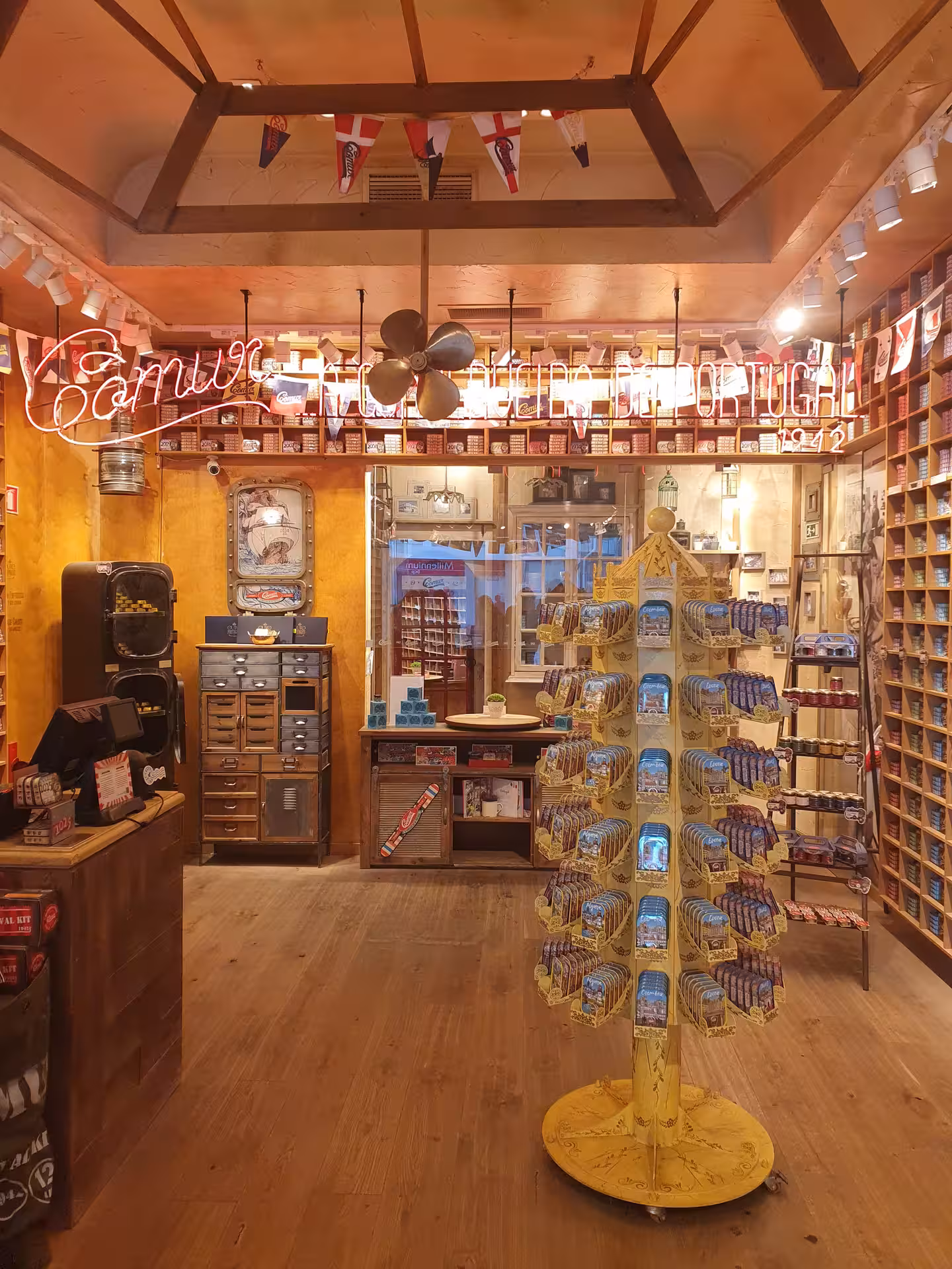 Charming Faro shop interior with vintage decor and colorful canned goods display for Algarve walking tour.