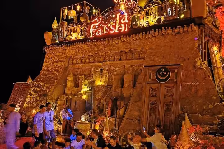 Farsha Cafe entrance lit at night in Sharm El Sheikh, included in Discover Farsha coffee and Soho Square private car tour
