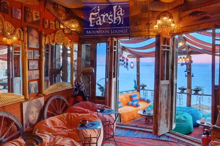 Farsha Mountain Lounge sea-view seating in Sharm El-Sheikh, cozy cafe with shisha included and welcome drink
