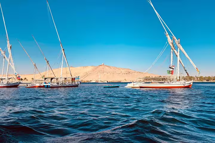 Felucca sailboats on the Nile in Aswan, scenic stop on private day tour to High Dam, Philae Temple and Obelisk