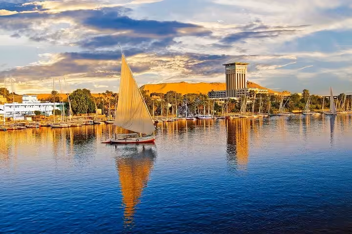 Traditional felucca sailing on the Nile in Luxor, scenic stop on a private full-day Valley of the Kings tour from Hurghada