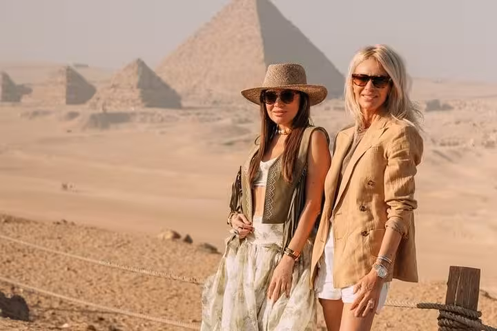 Women at Giza Plateau viewpoint with Great Pyramid backdrop on expert female Egyptologist pyramids tour