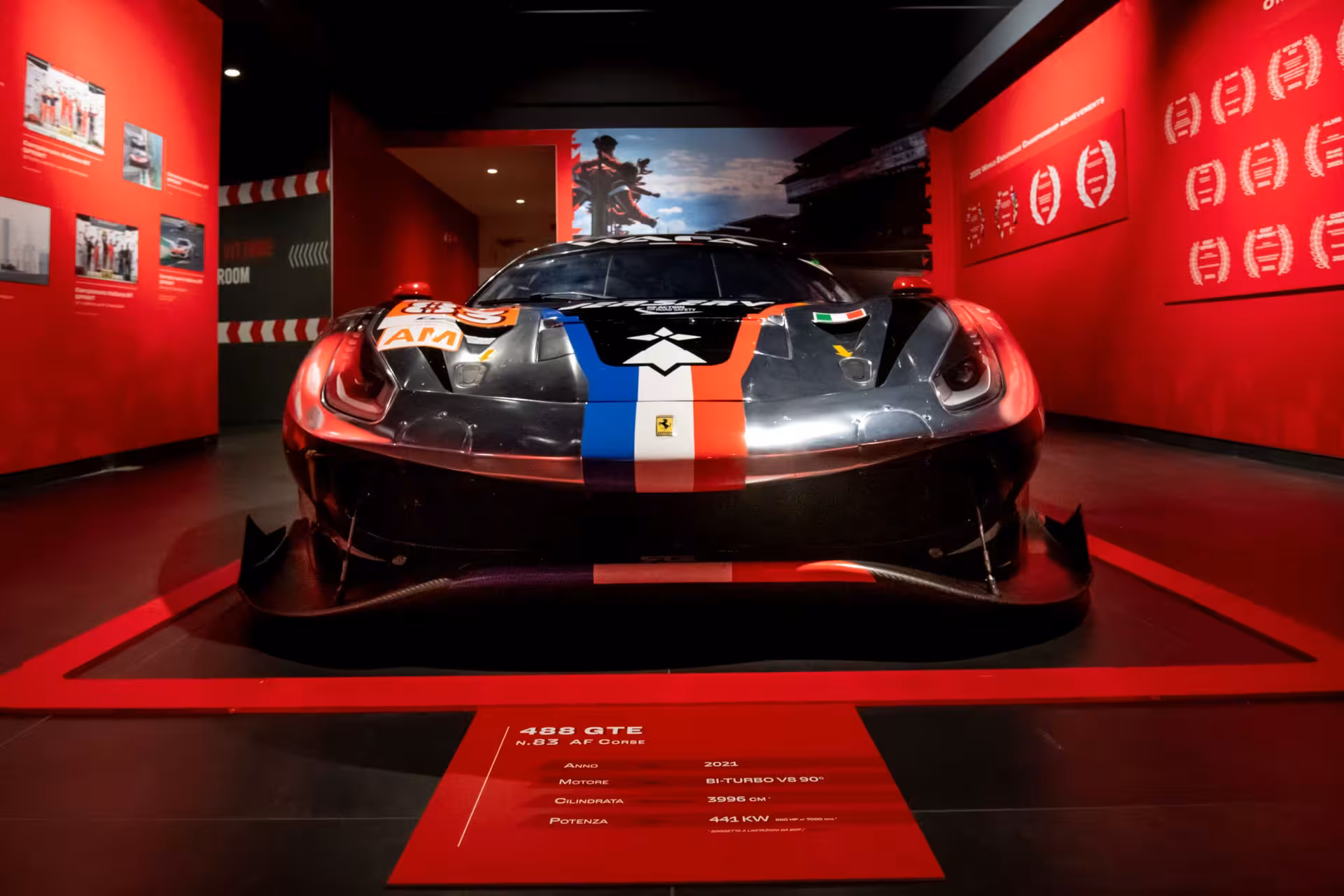 Ferrari 488 GTE race car on display inside Maranello Ferrari Museum, included in combo ticket experience