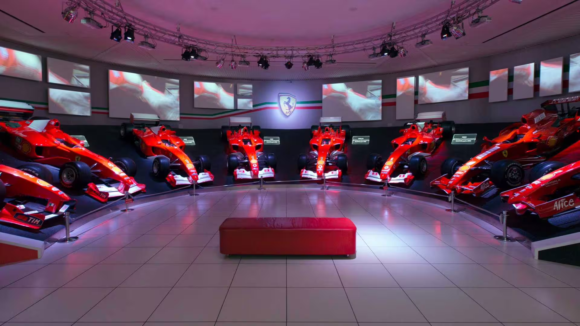 A stunning display of Ferrari Formula 1 cars at the Maranello Museum, showcasing automotive excellence in Modena.