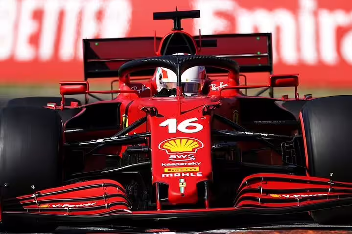 Close-up of a modern red Ferrari Formula 1 car at speed, highlight of a private Ferrari Museum tour in Modena, Italy